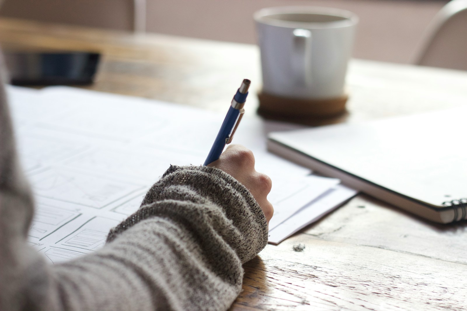 Writing on paper at a desk